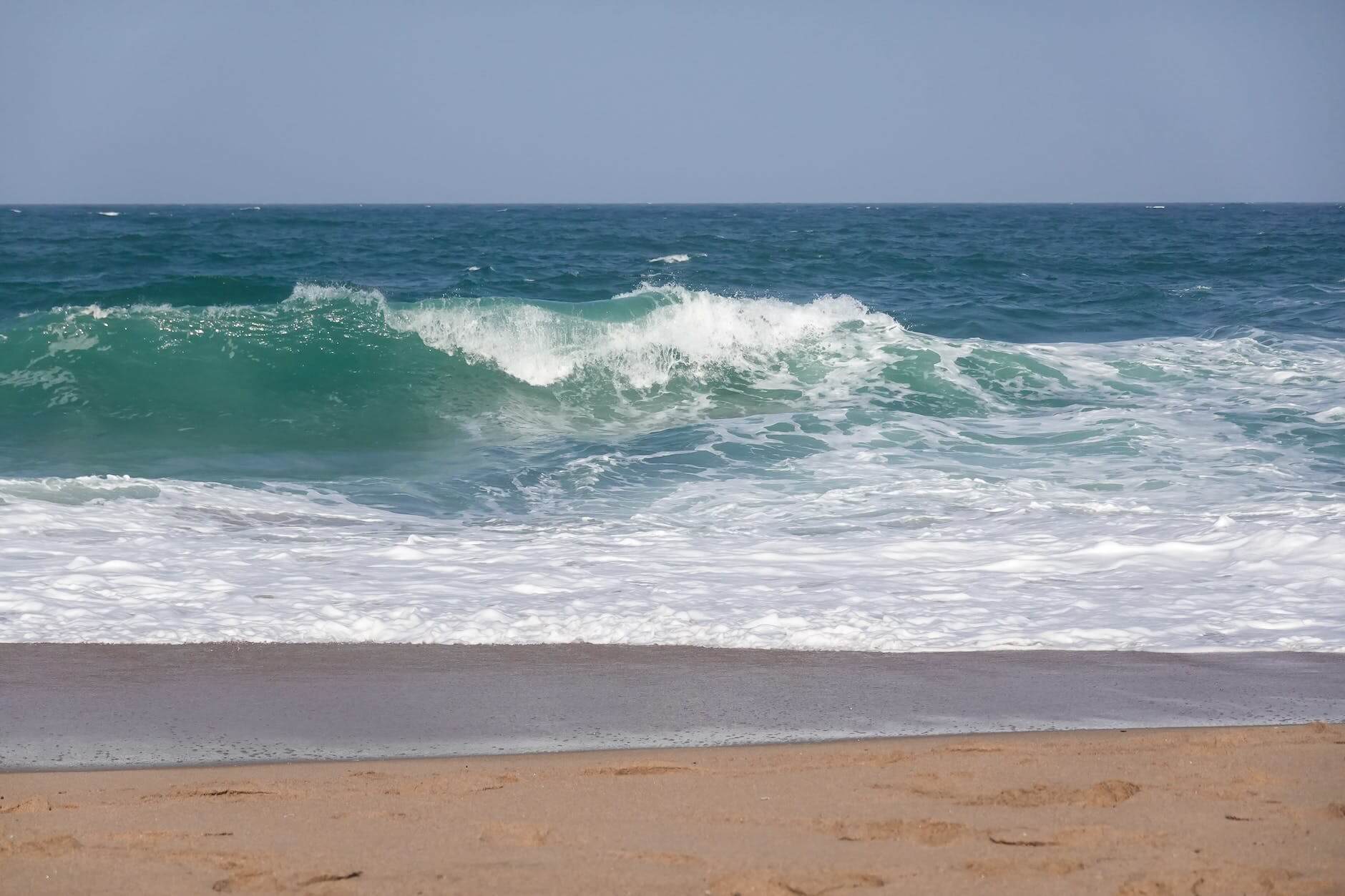 sea waves crashing on the shore